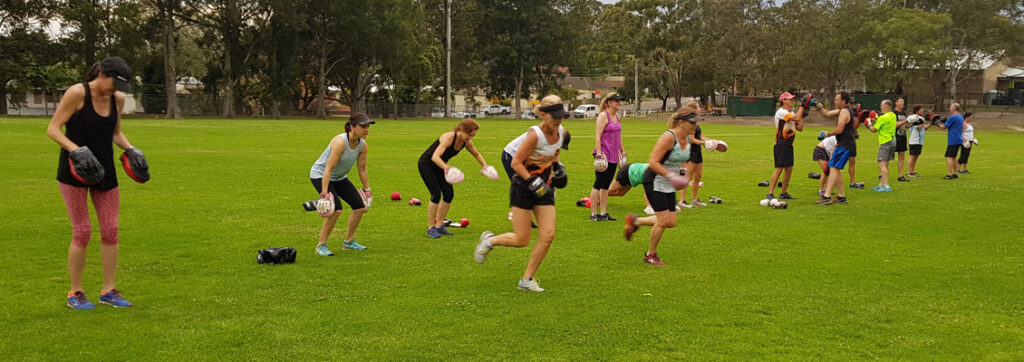 Outdoor bootcamp and boxing training compared to gym workouts in Sydney