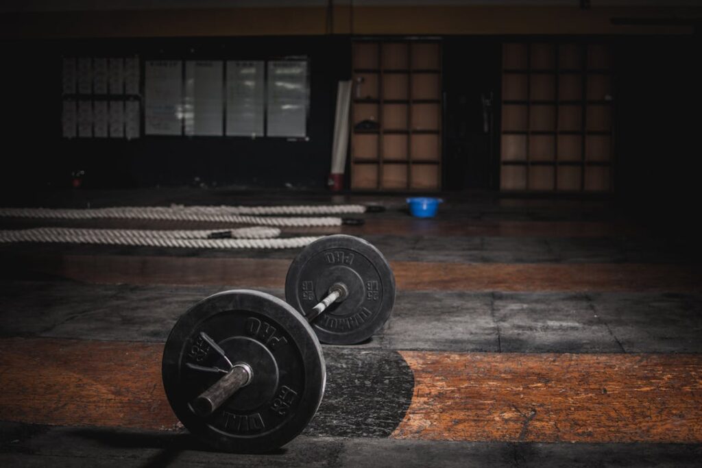 Barbell and battle ropes in a strength and conditioning gym setup in Sydney
