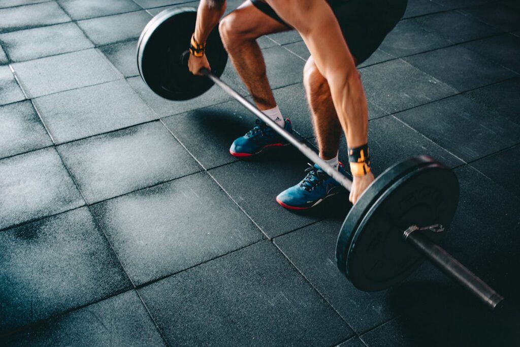 How to Build a Consistent Training Routine Runner maintaining consistent training routine on an outdoor track in Sydney