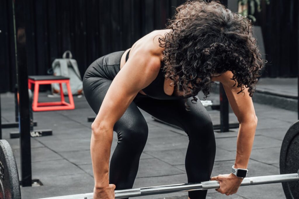 Training for Life, Not Just for Summer Woman training with barbell showing year-round fitness commitment in Sydney