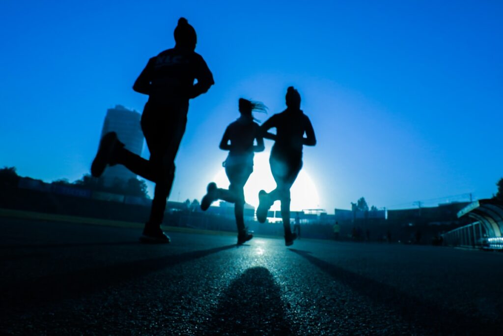 Woman running outdoors combining cardio and strength training in Sydney